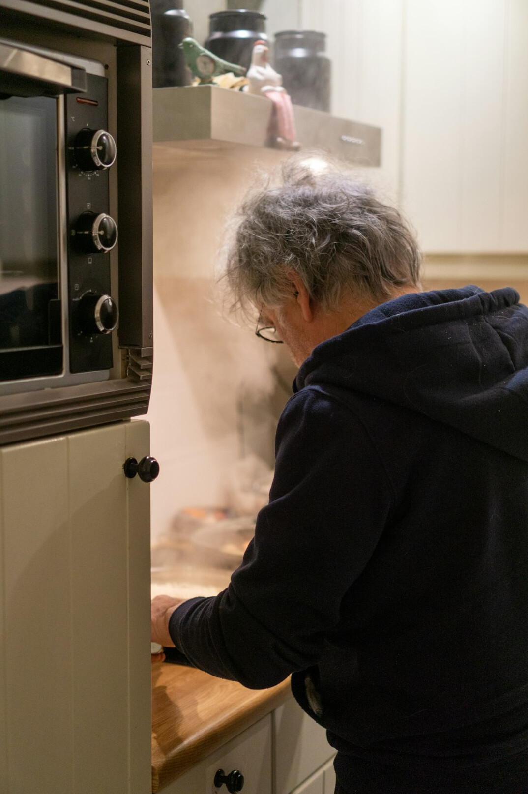 Elderly Danish woman baking bread in her kitchen